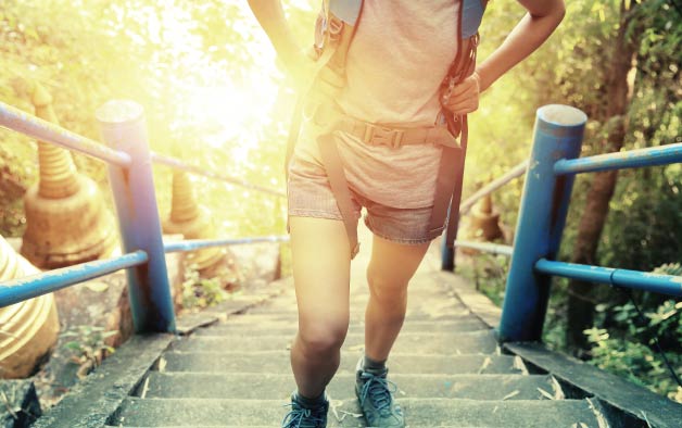 Man hiking up stairs