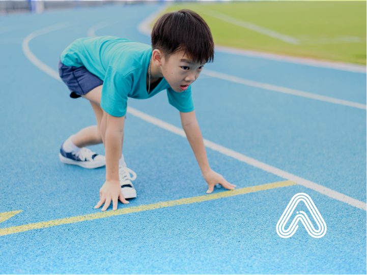 Young boy at running start line PE