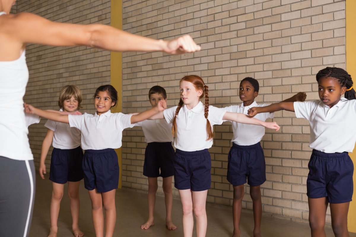 children doing PE in school