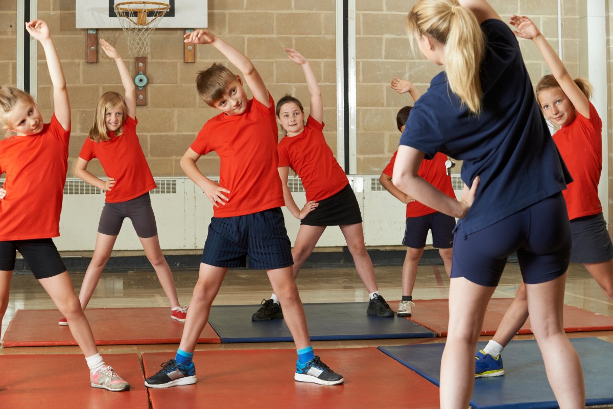 children doing PE in school