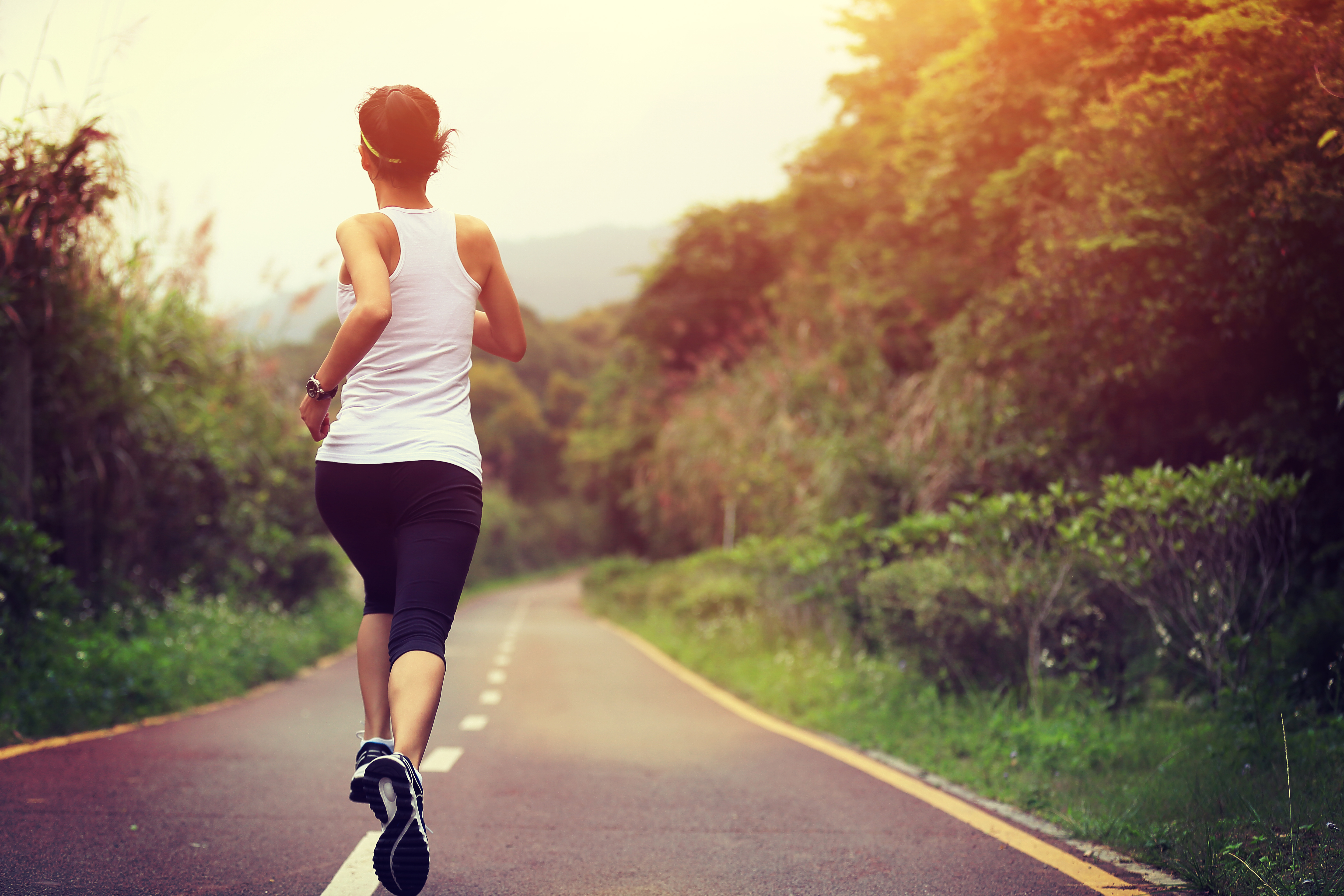 Woman running down the road