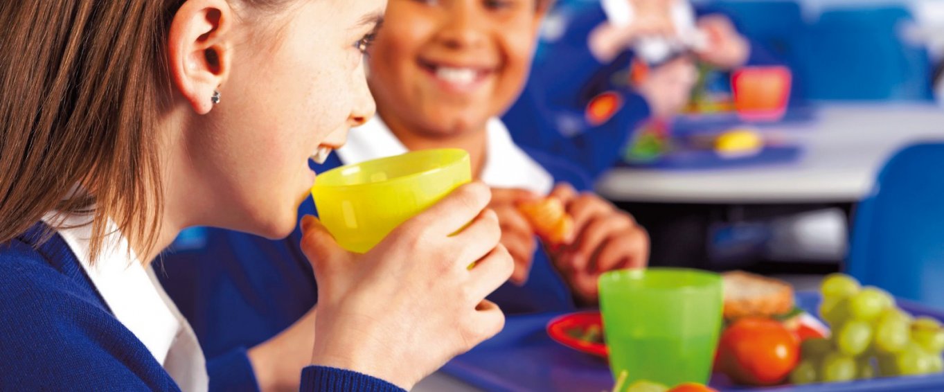 Two Young People Eating a Healthy School Lunch Two Young People Eating a Healthy School Lunch