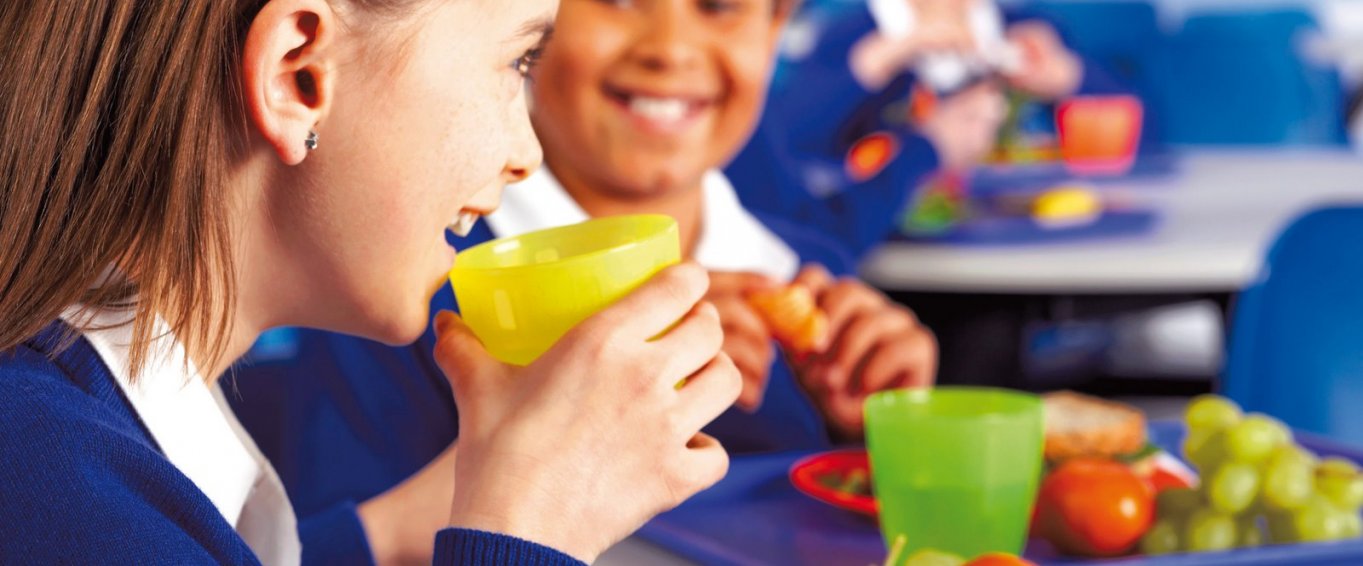 Two Young People Eating a Healthy School Lunch