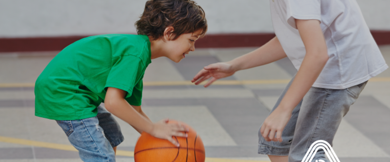 Young children playing basket ball Young children playing basket ball