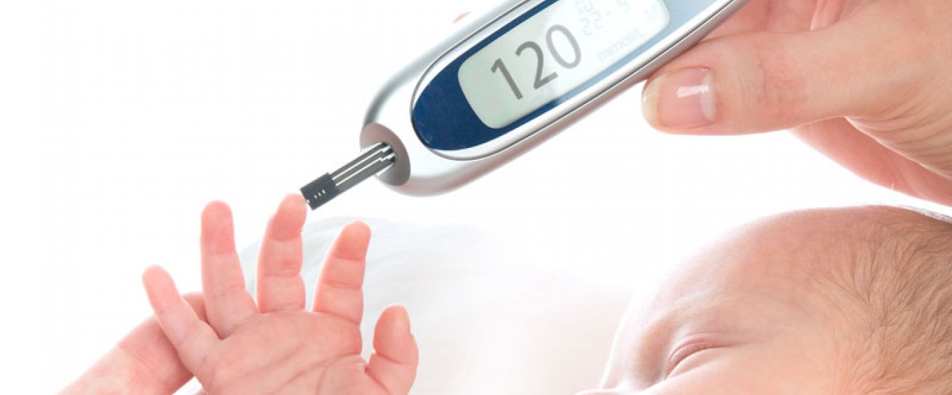 Baby being tested with a thermometer