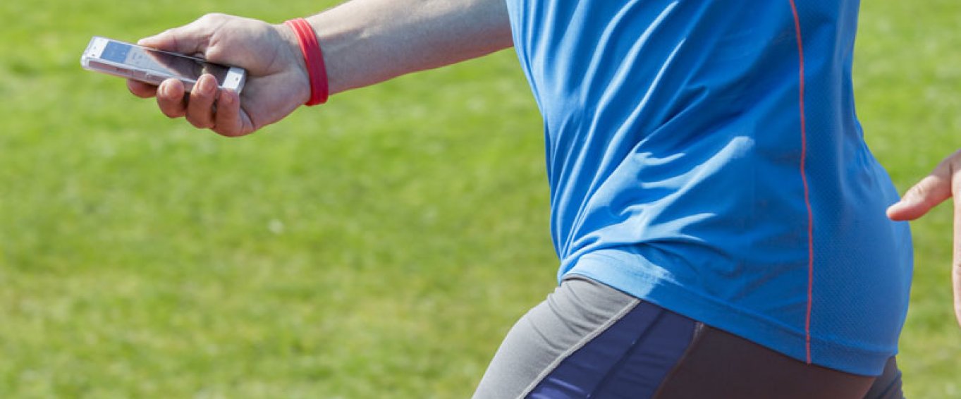 Man running with a fitness tracker Man running with a fitness tracker