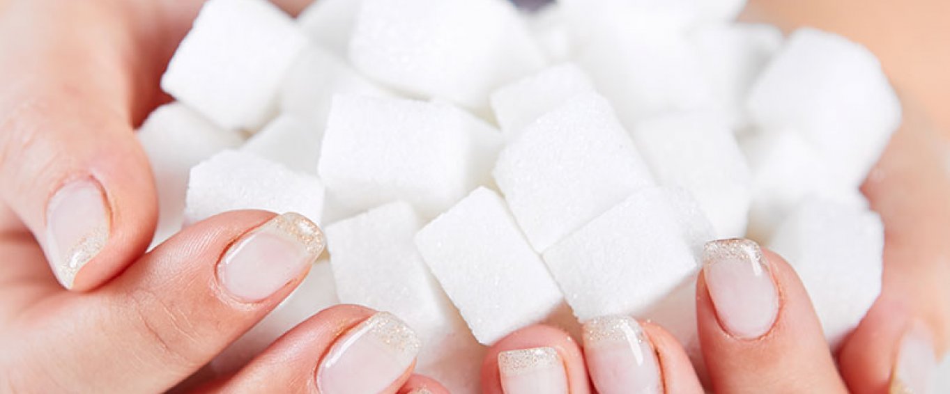 Woman holding sugarcubes