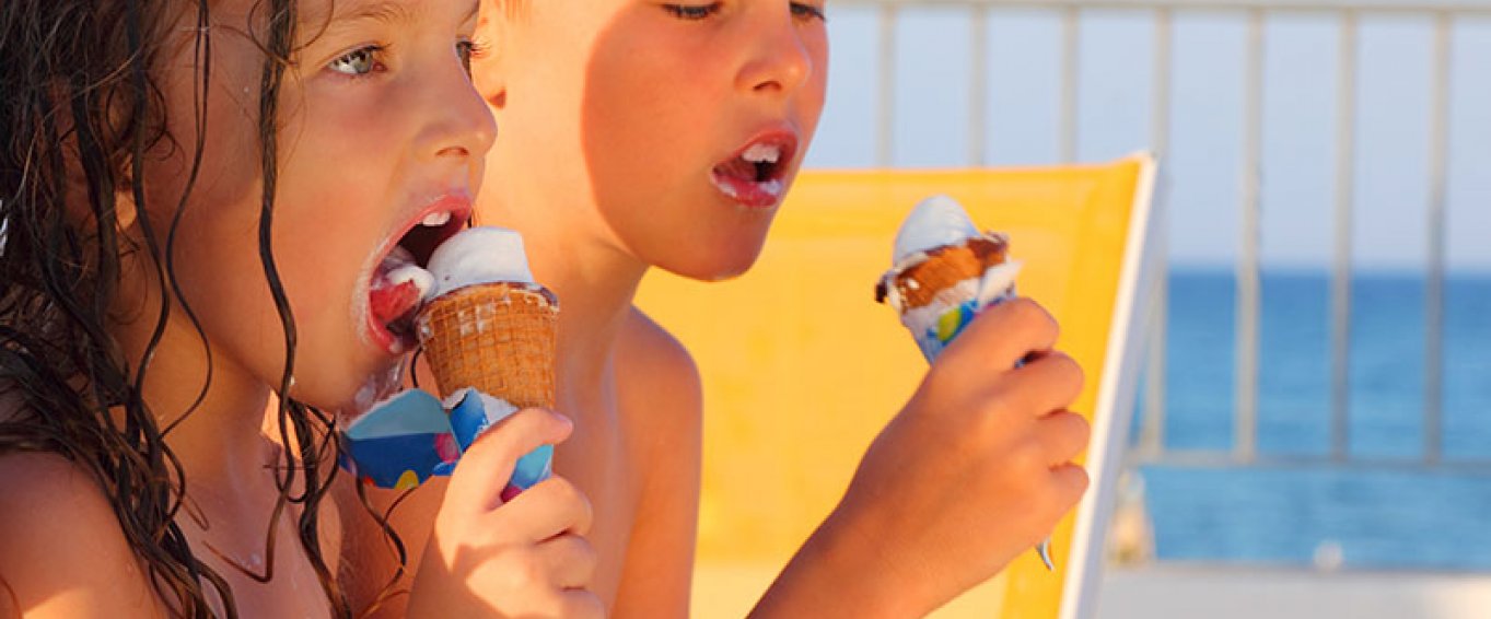 Kids eating ice cream on a beach