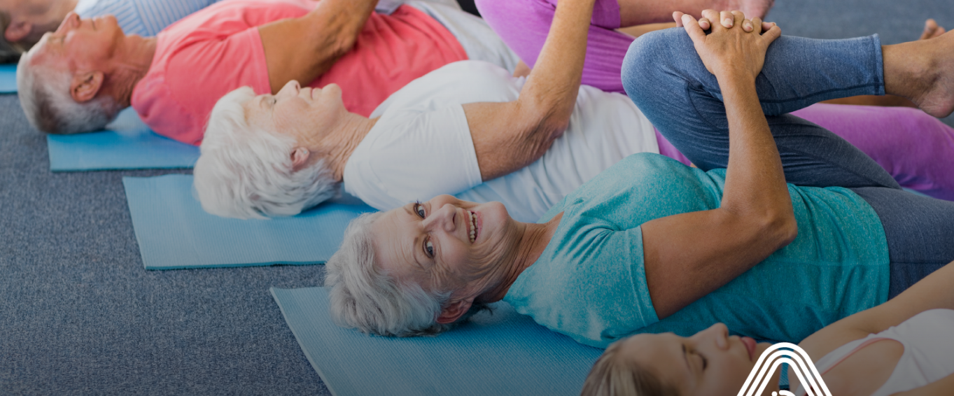 older adults doing exercise on a matt