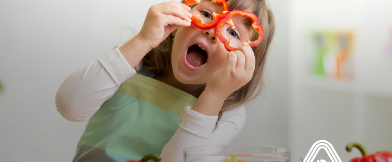 Child playing with vegetables cooking Child playing with vegetables cooking