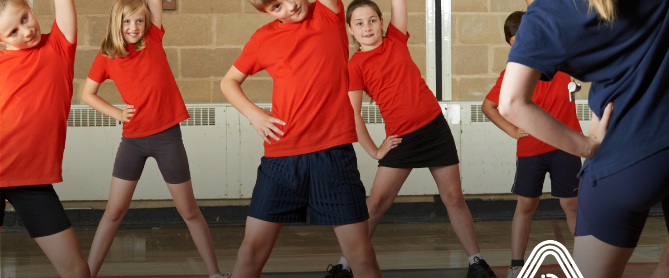Children doing PE in red t-shirts