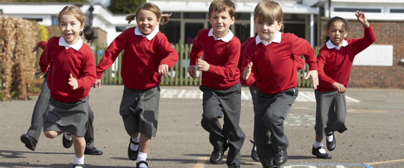 Primary School Children Running in the Playground Primary School Children Running in the Playground