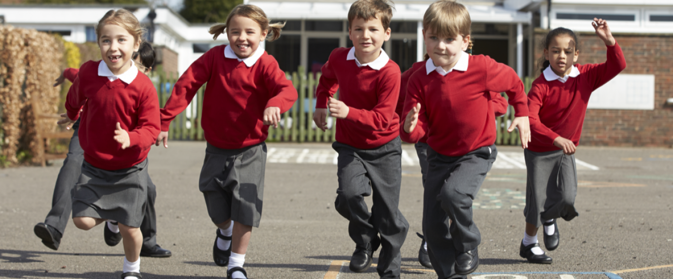 Primary School Children Running in the Playground