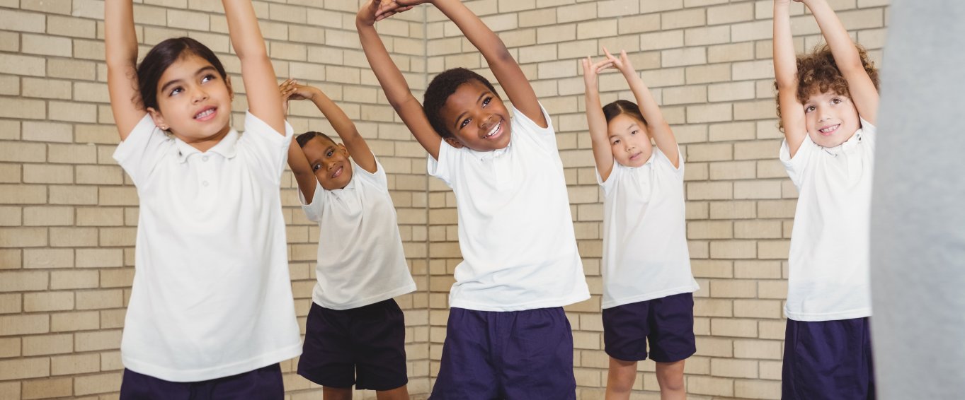 Young Kids Performing a Stretch Young Kids Performing a Stretch