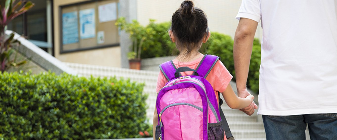 Girl with Pink Backpack Holding an Adult's Hand Girl with Pink Backpack Holding an Adult's Hand