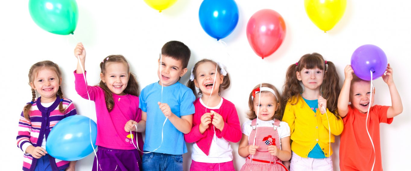 7 Children Holding Colourful Balloons