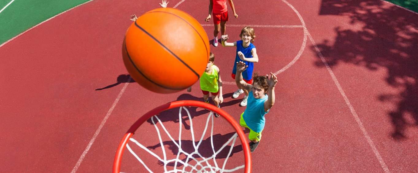 Young Children Shooting Basketball Hoops Young Children Shooting Basketball Hoops
