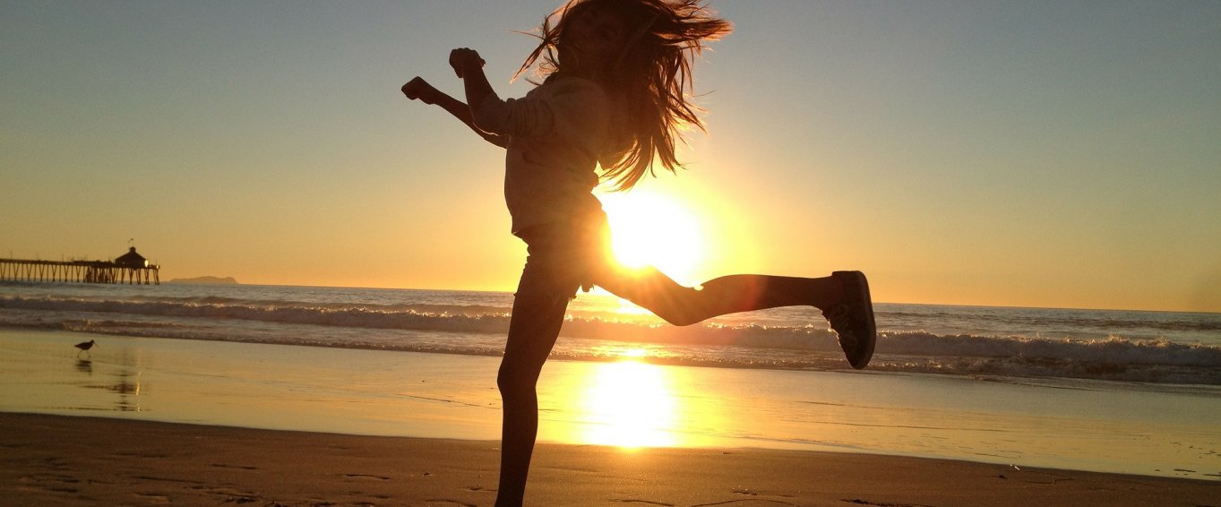 Girl Leaping on a Beach