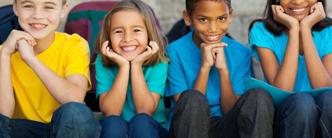 four-children-in-tshirts-smiling