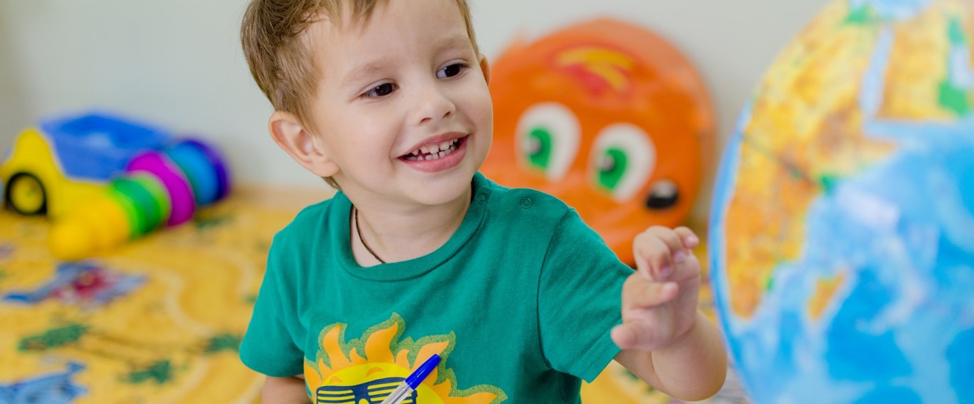 Small boy happy in the classroom