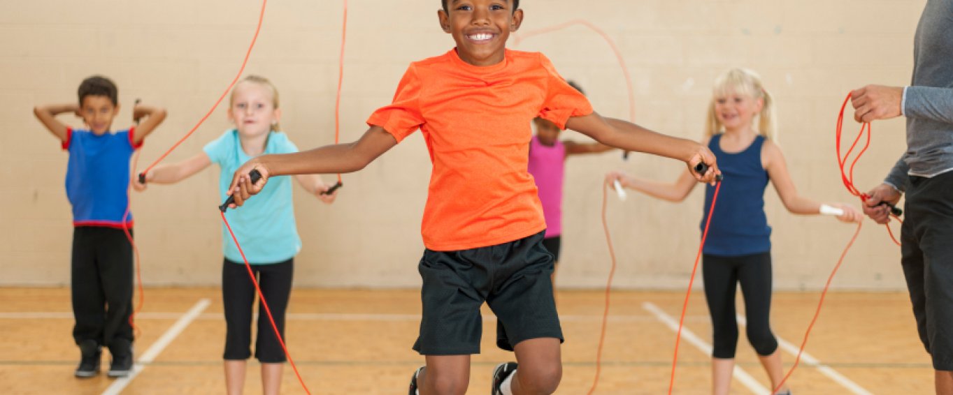Children Playing Jump Rope in Gym Class