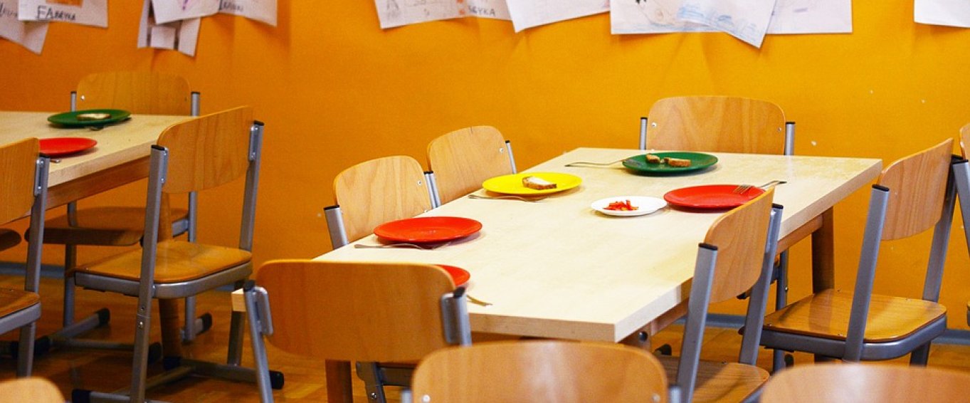 School Dining Hall with Plates Set for Lunch