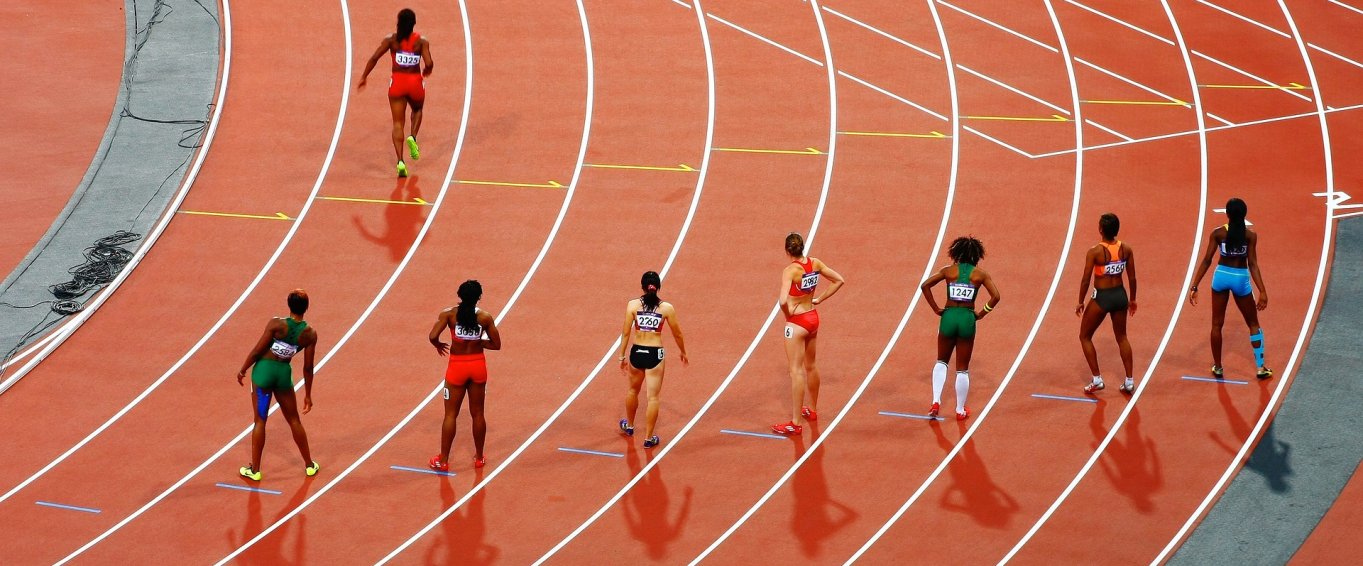 Women Athletes Preparing for a Race Women Athletes Preparing for a Race