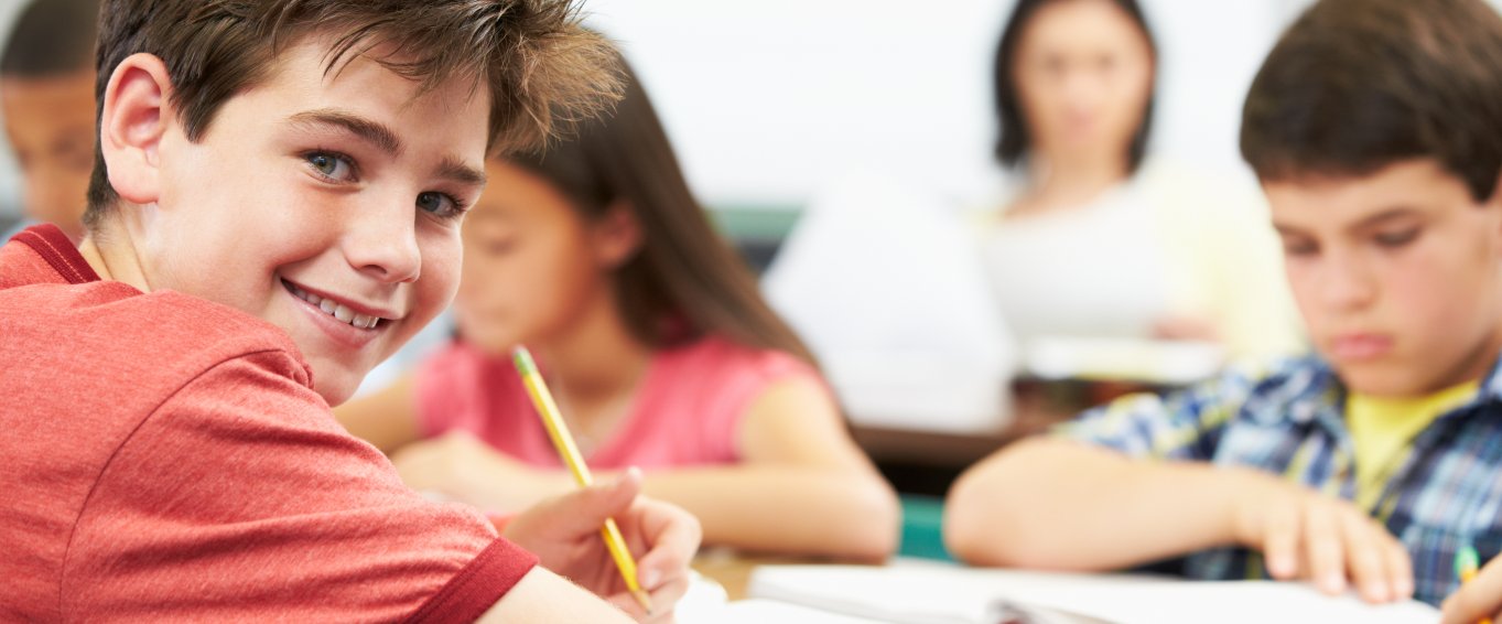 Young boy learning at school Young boy learning at school