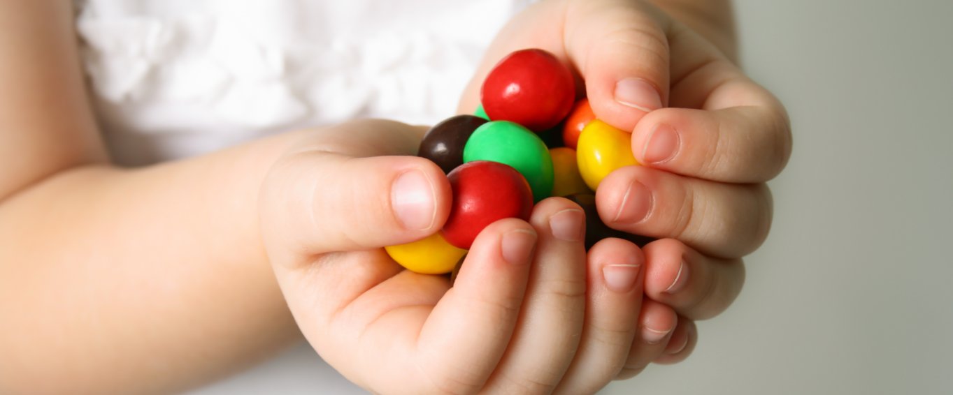 Child holding sweeties