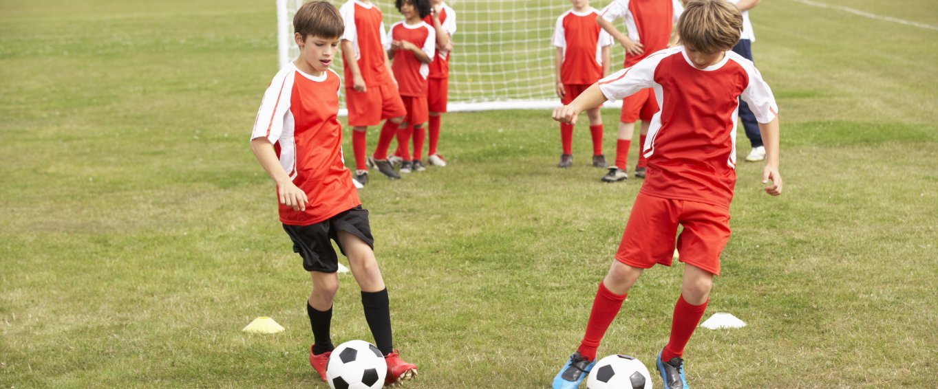 Young kids playing football