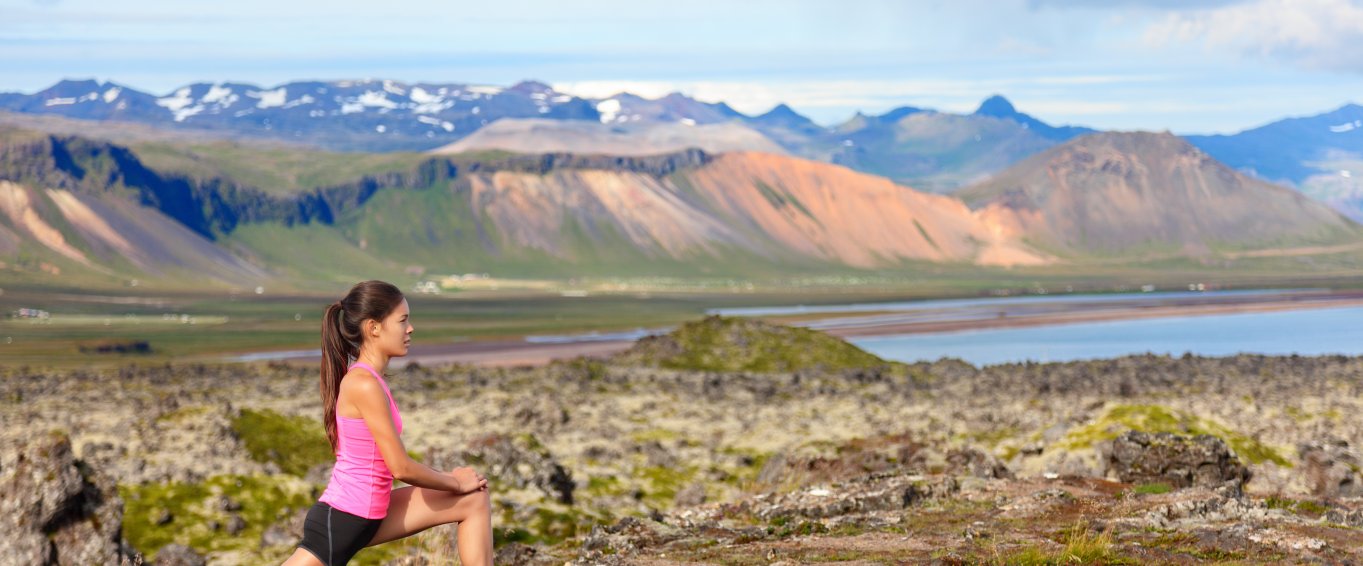 woman lunging on mountain 