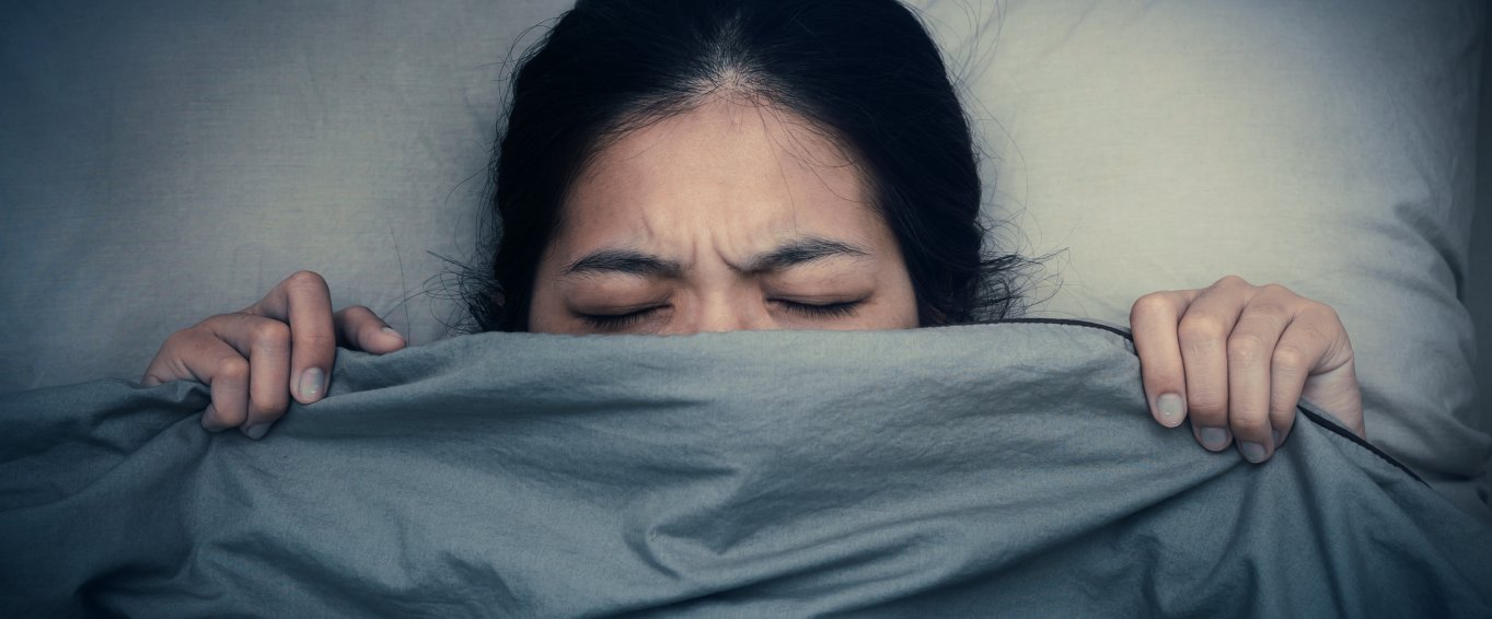 Woman struggling to get to sleep