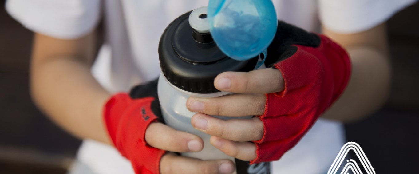 boy holding water bottle