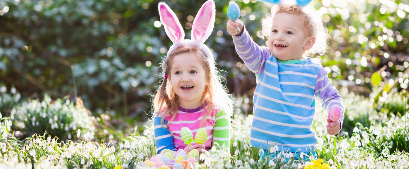 Children in forest doing Easter egg hunt Children in forest doing Easter egg hunt