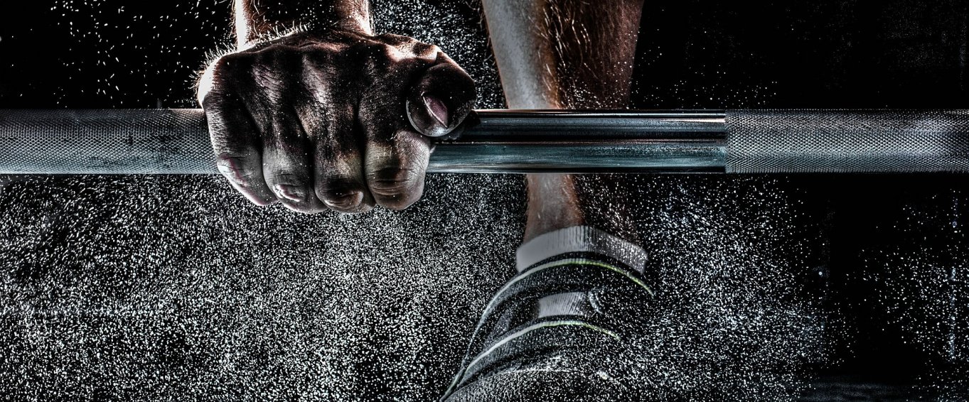 Personal trainer lifting weights