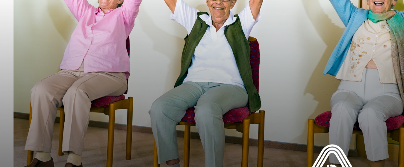 Older ladies exercising while sat down