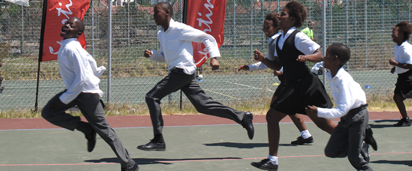 Six School Pupils in Uniform Running