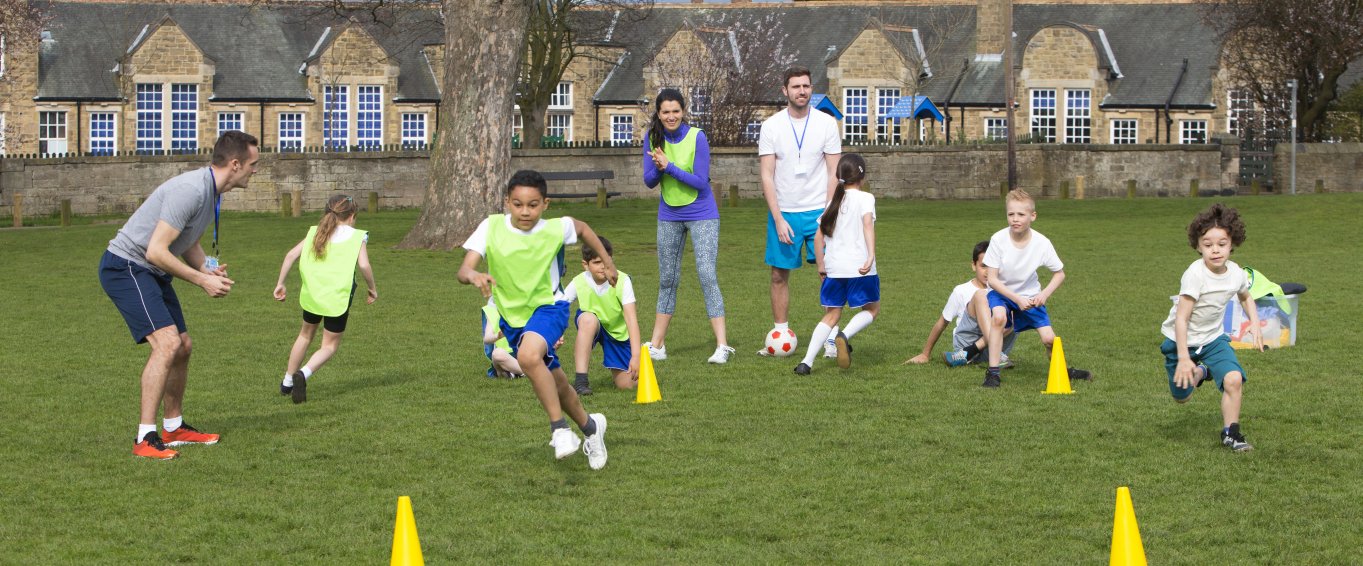 primary school kids playing football