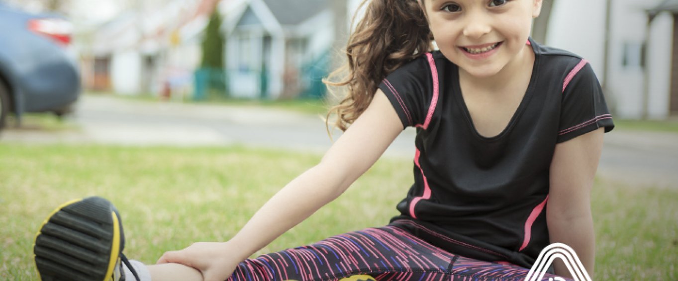 Young girl sat outside sports