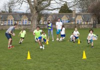 primary school kids playing football