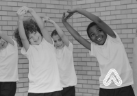 Children stretching in PE lesson