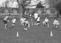 primary school kids playing football