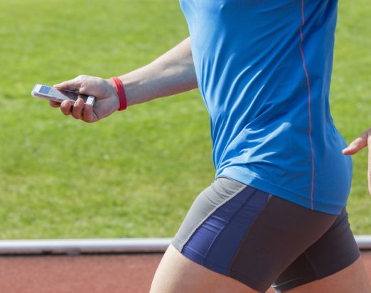 Man running with a fitness tracker