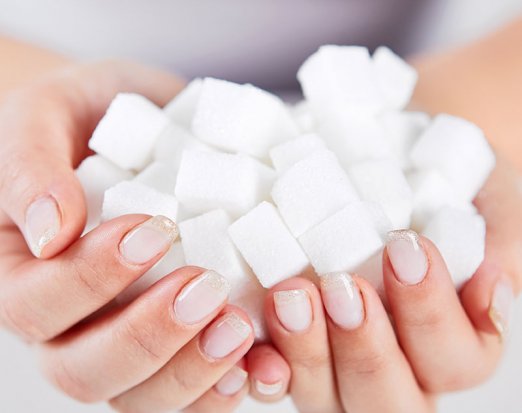 Woman holding sugarcubes