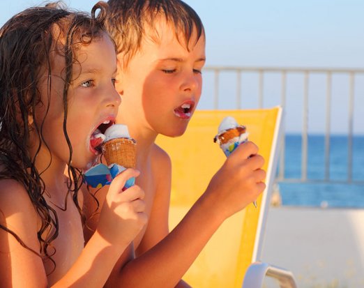 Kids eating ice cream on a beach