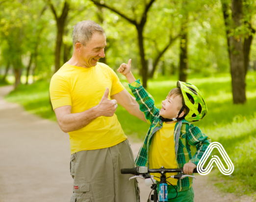 Older man and young boy with bike 