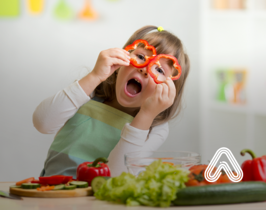 Child playing with vegetables cooking
