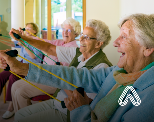 Group of older people sat down doing exercises