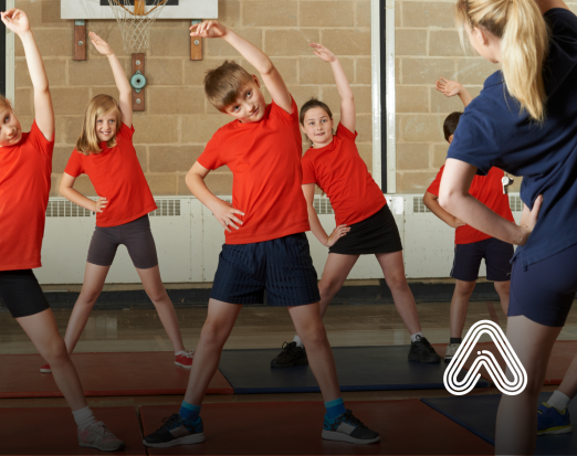 Children doing PE in red t-shirts