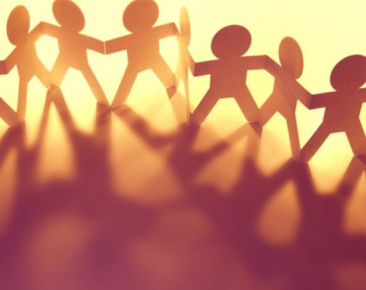 Paper people casting a shadow